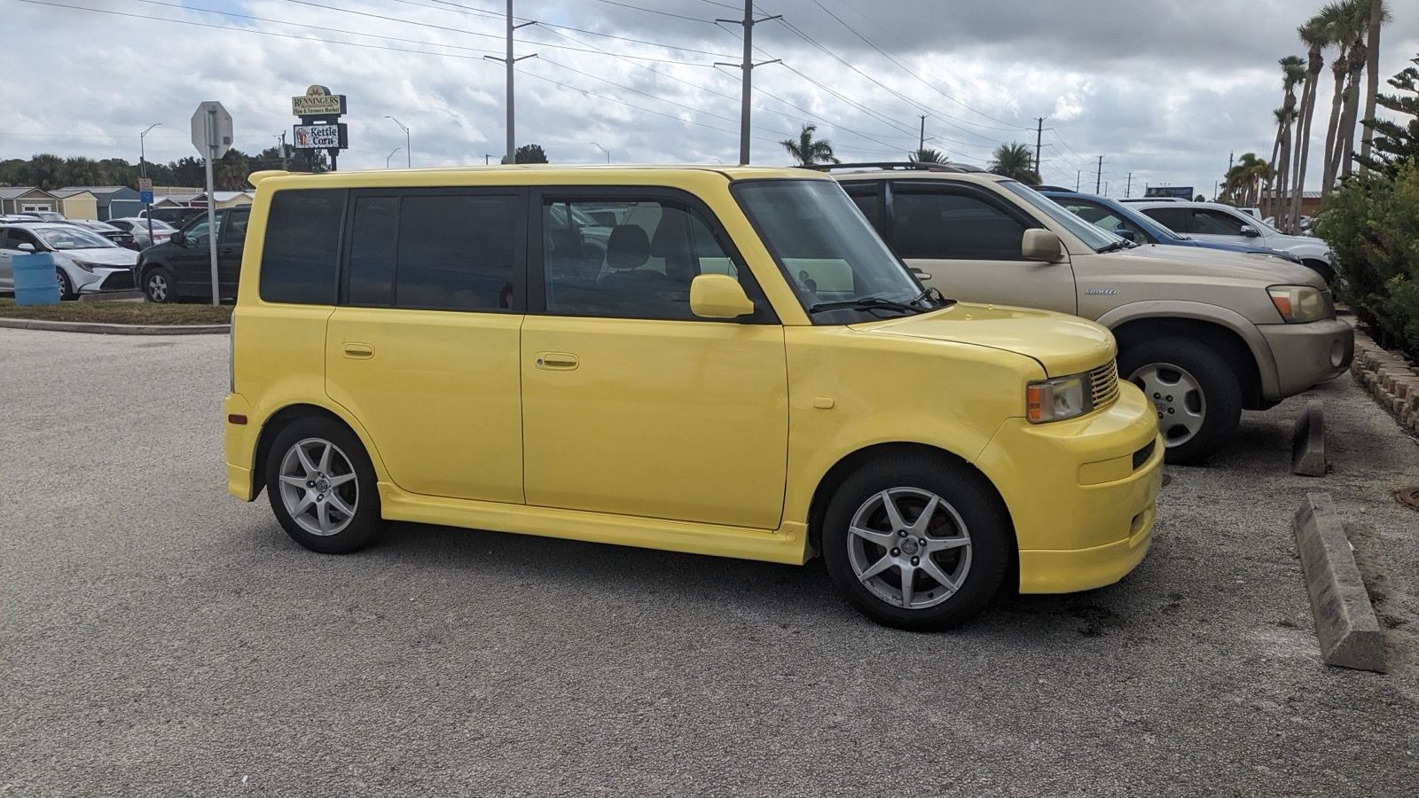 Yellow 2004 Scion xB first-generation hatchback, front three-quarter view