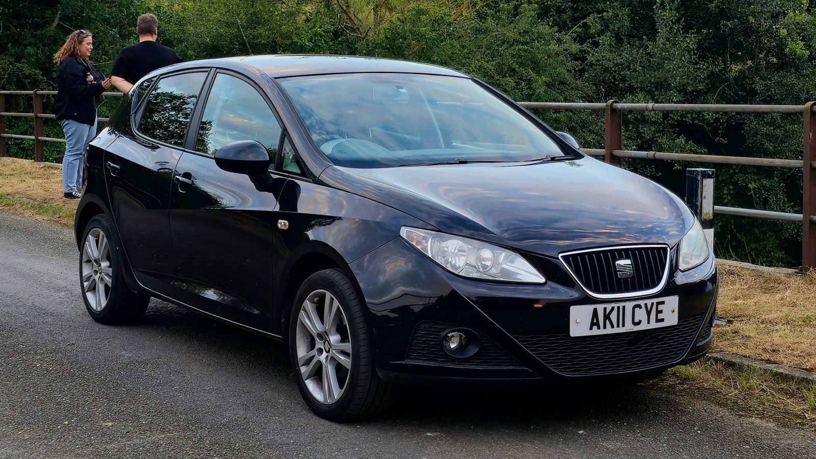 Black 2011 SEAT Ibiza Mk4 five-door hatchback, front three-quarter view