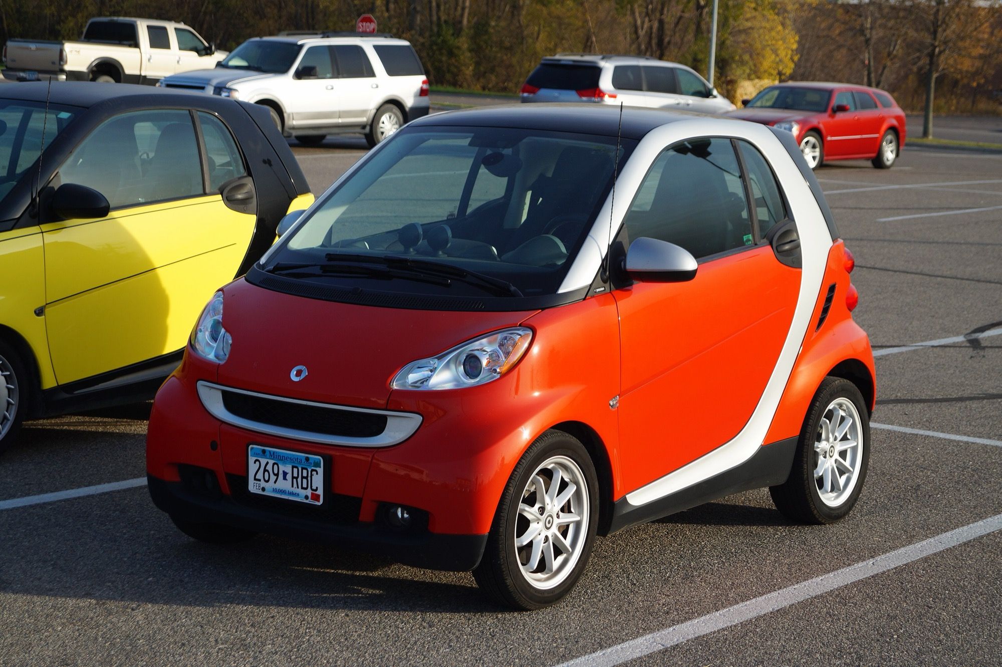 Orange and silver 2008 Smart Fortwo (W451), front three-quarter view