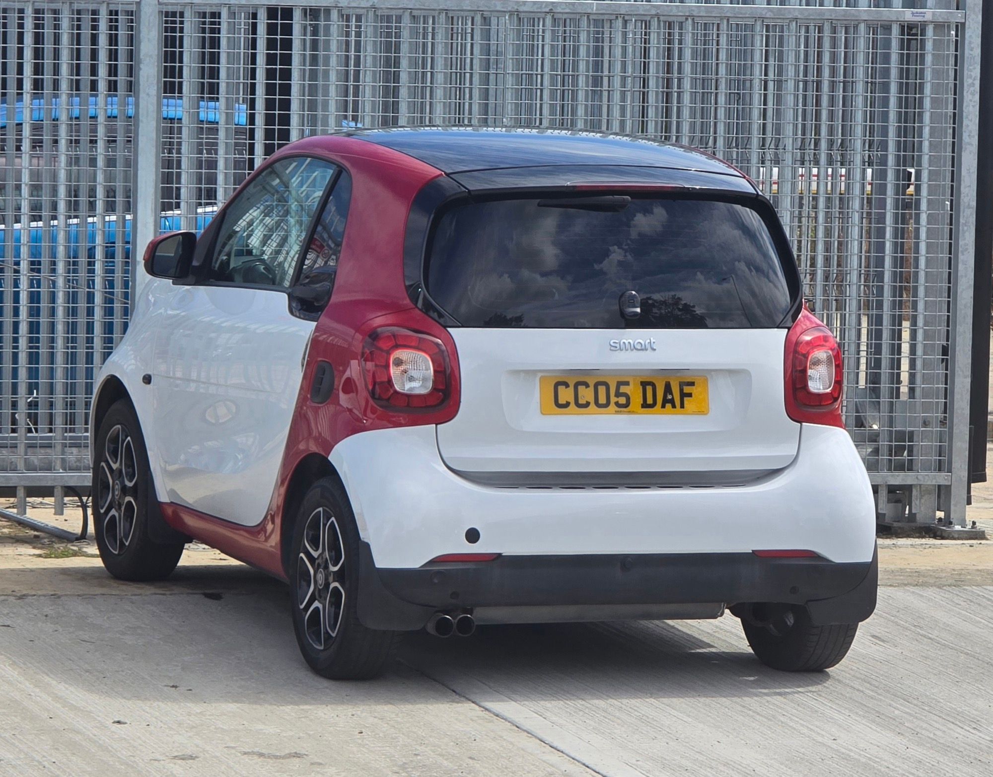 White and red 2018 Smart Fortwo (C453), rear three-quarter view