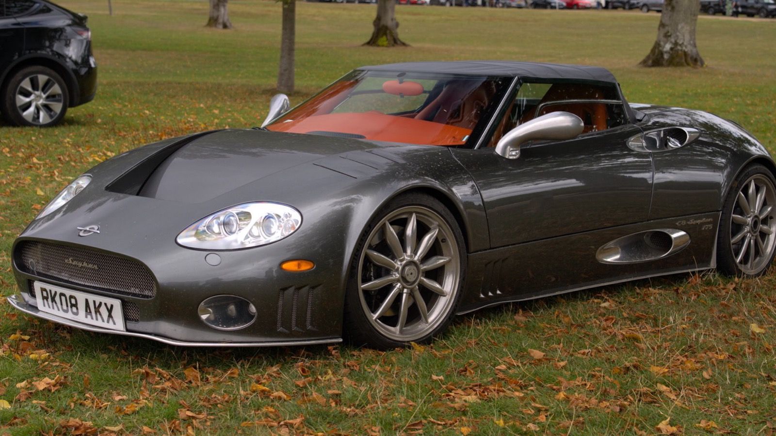 Grey 2008 Spyker C8 Spyder, front three-quarter view