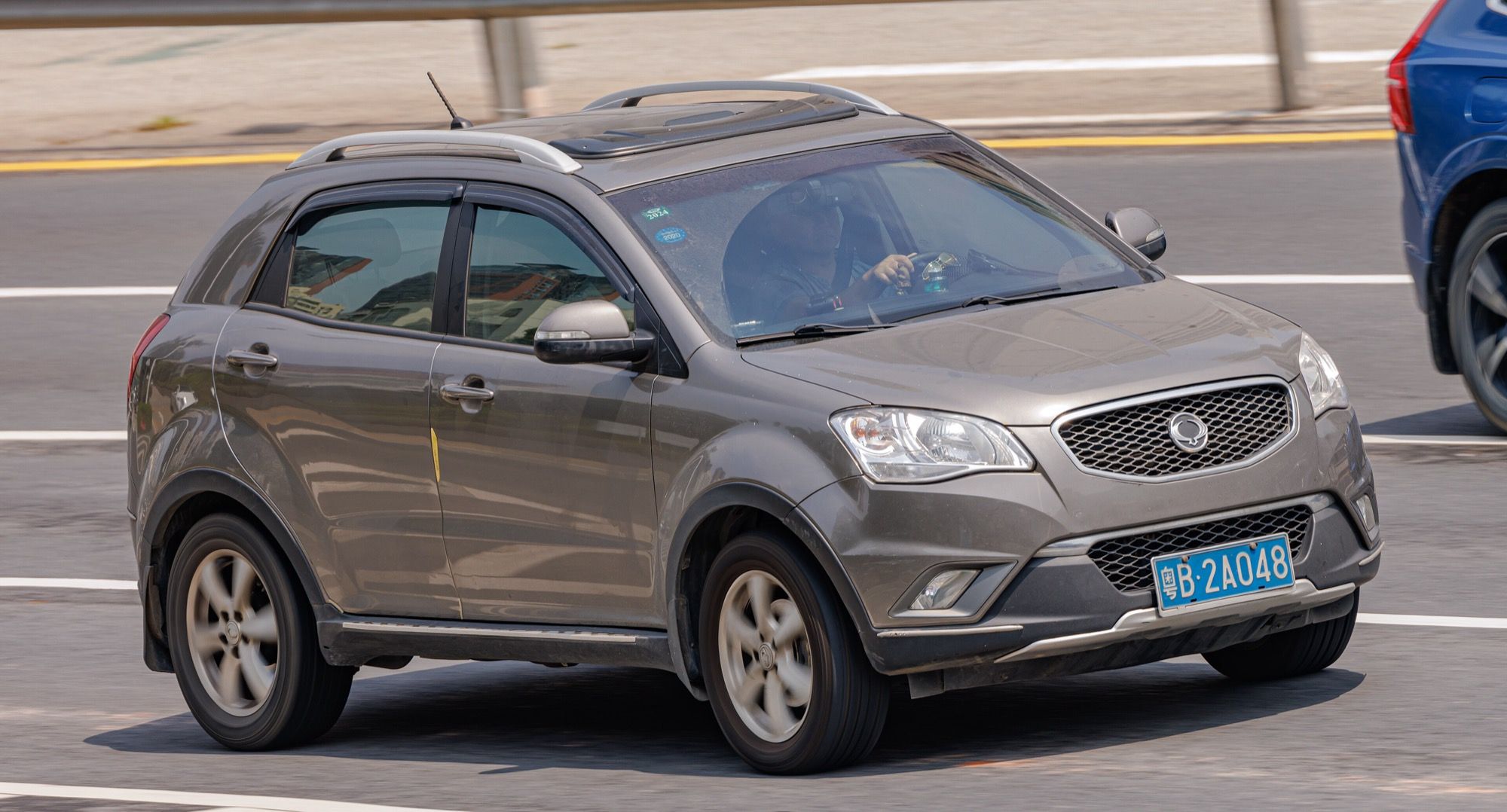 Grey third-generation SsangYong Korando C200, front three-quarter view