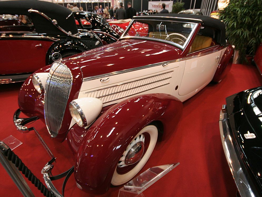 Maroon and cream 1937 Steyr 220 Gläser Sport Cabriolet, front three-quarter view