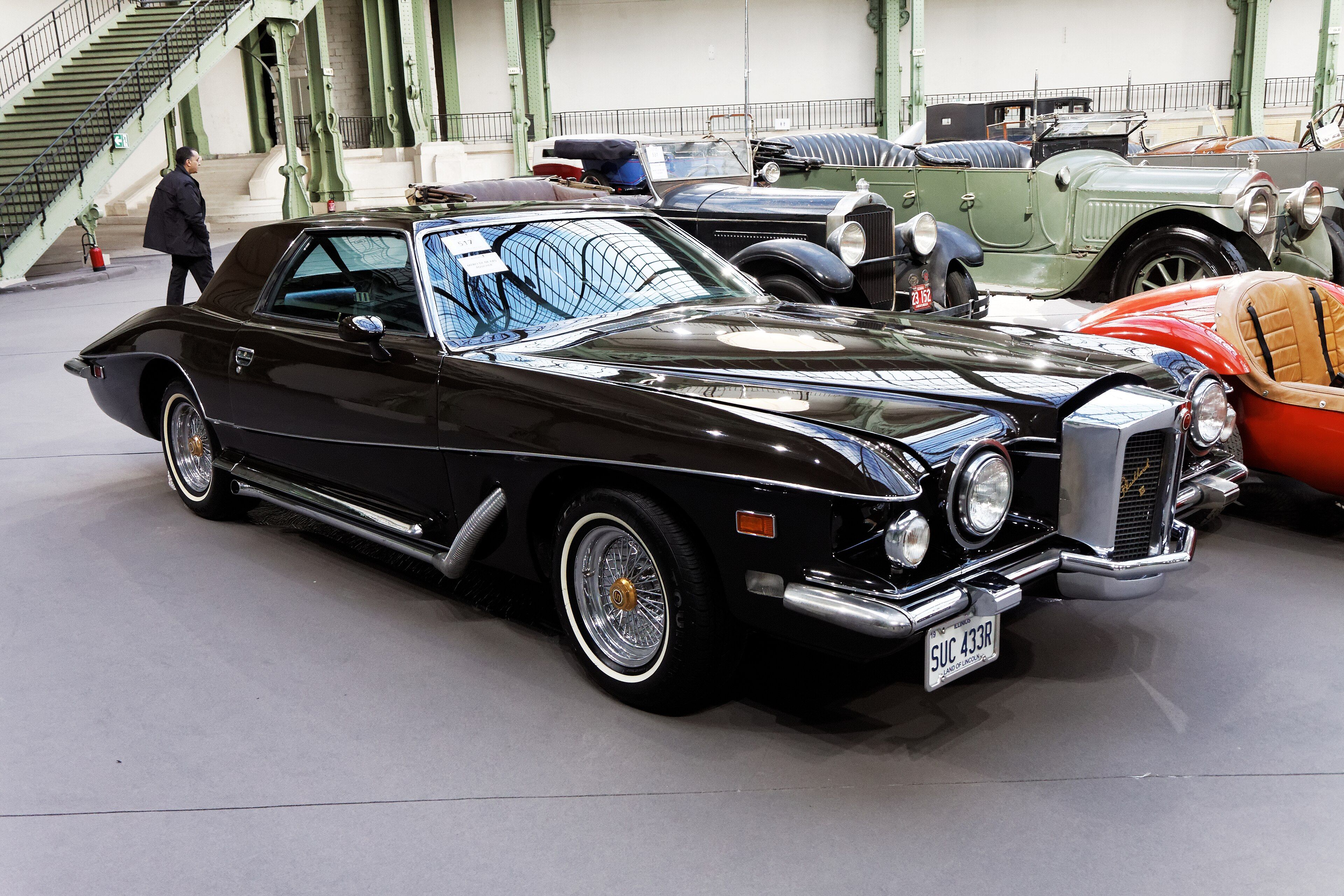 Dark maroon 1977 Stutz Blackhawk VI coupe, front three-quarter view