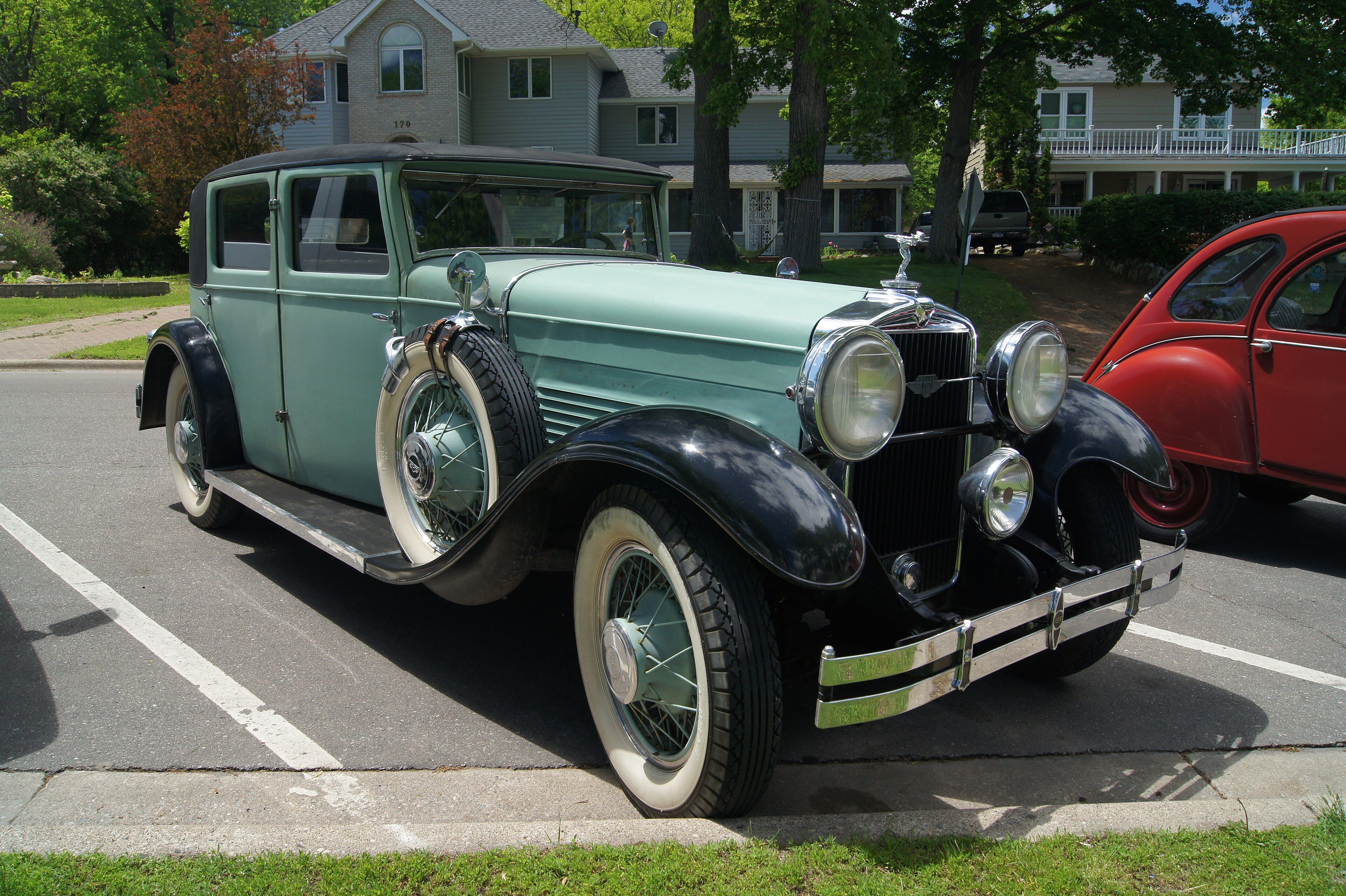 Light green 1930 Stutz Model 8 sedan, front three-quarter view