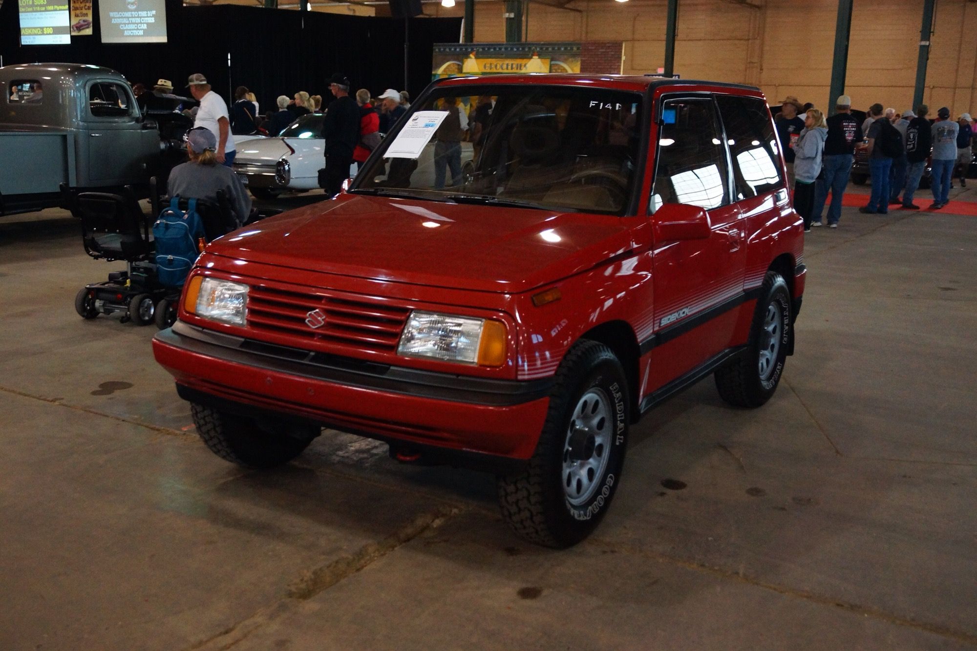Red 1989 Suzuki Sidekick JLK hardtop, front three-quarter view