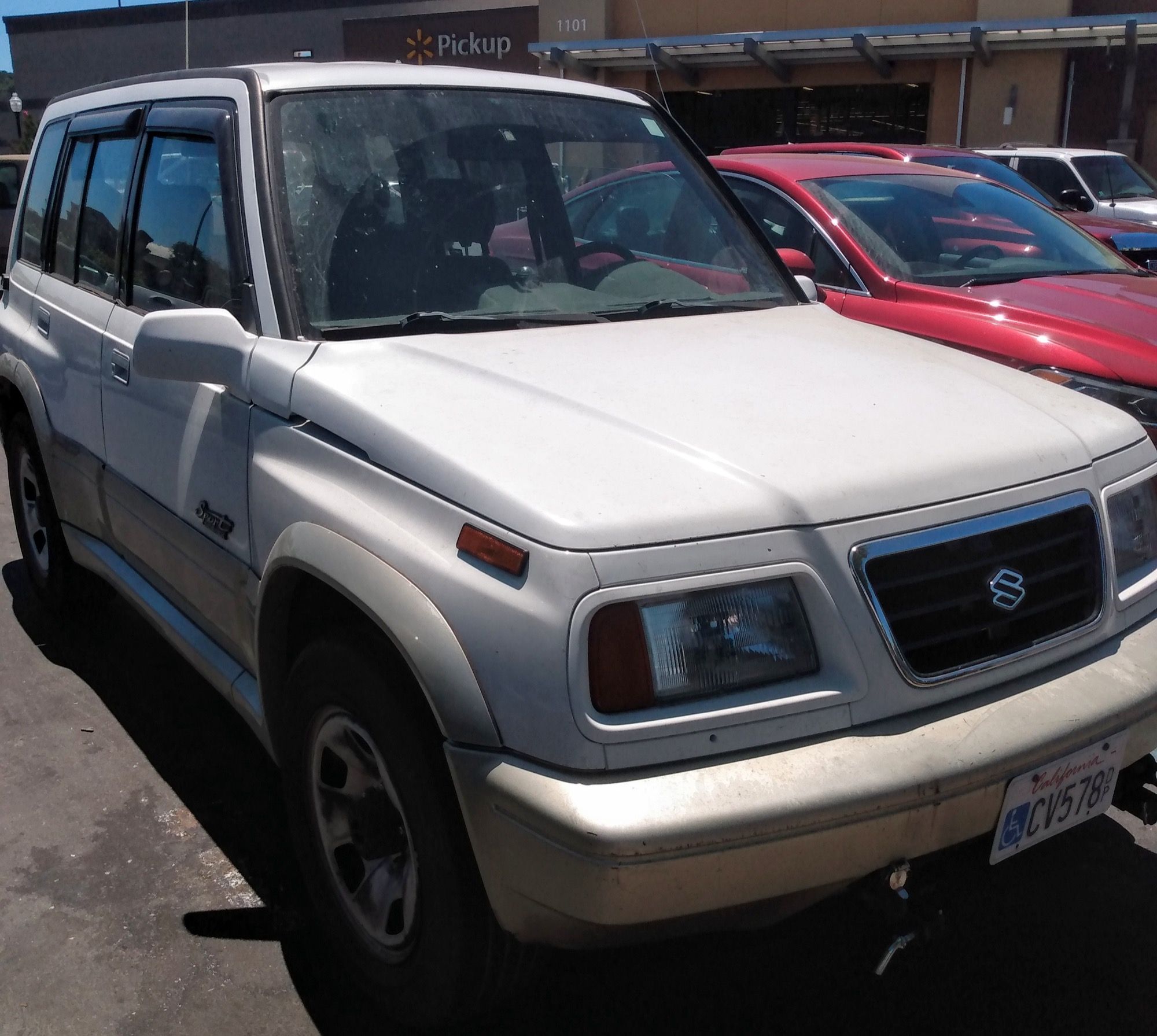 1997 Suzuki Sidekick JX Sport, front three-quarter view