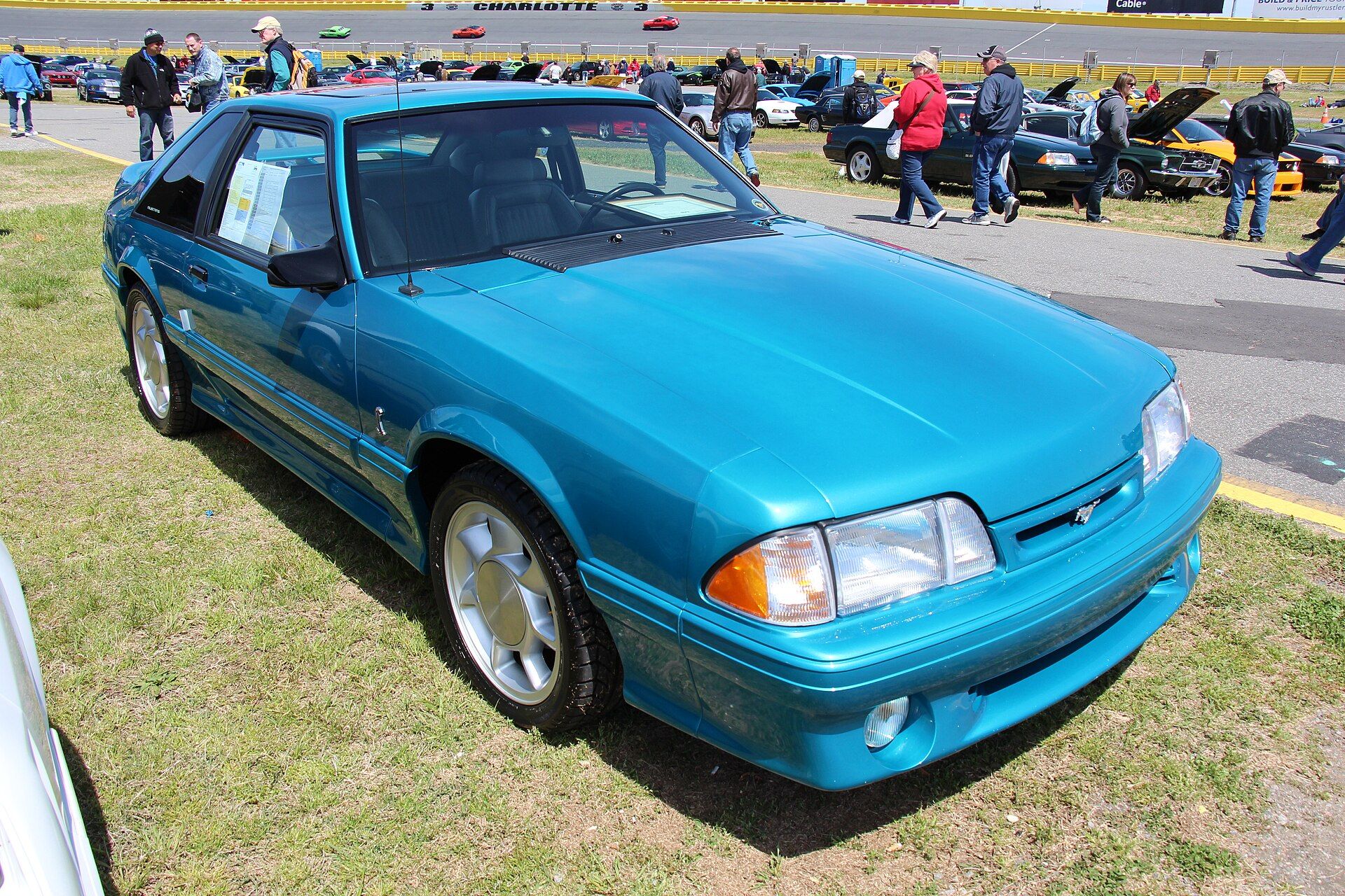 Teal 1993 Ford Mustang SVT Cobra hatchback photographed from the front left