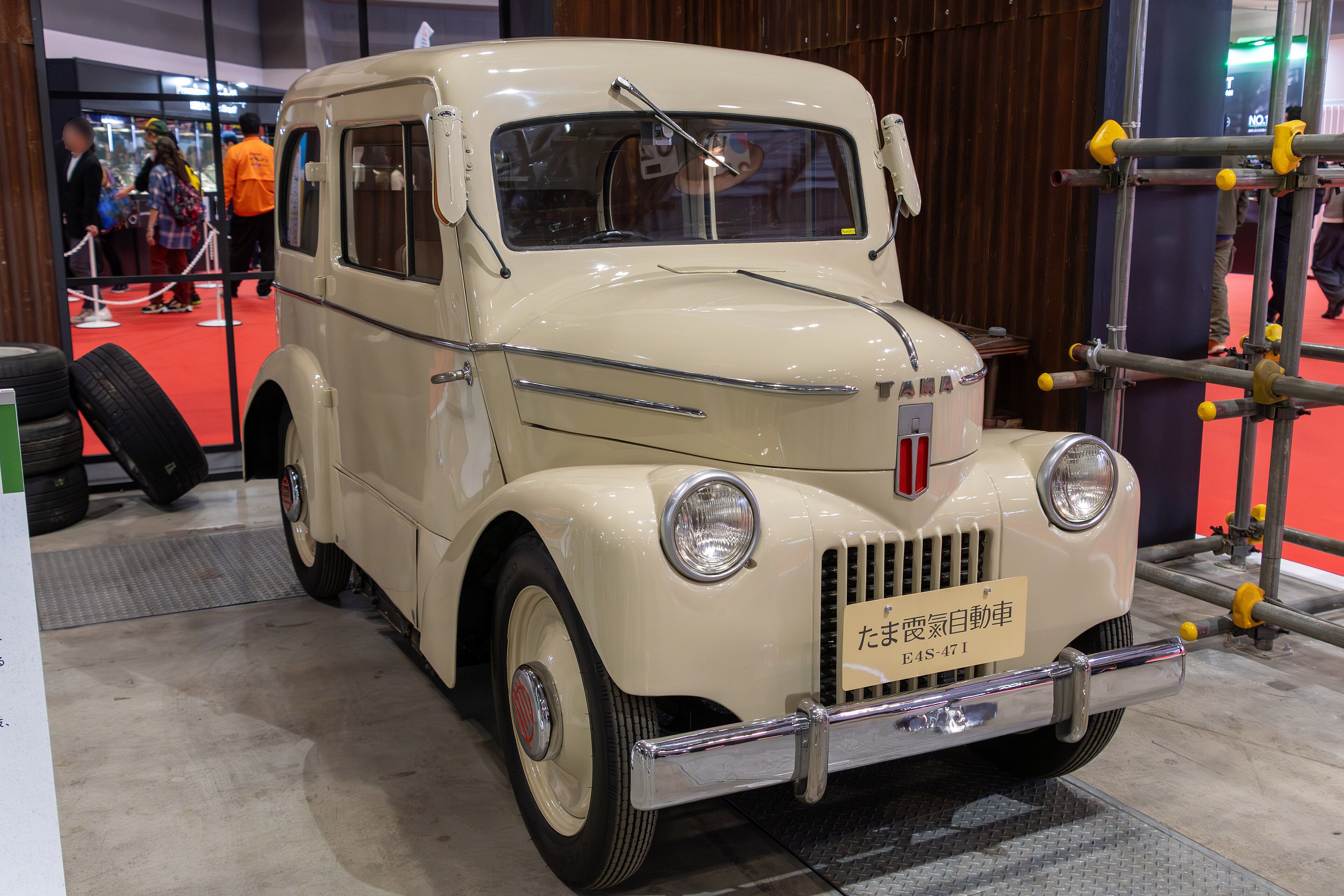 Cream Tama E4S-47 I four-seat electric sedan on museum display, front three-quarter view