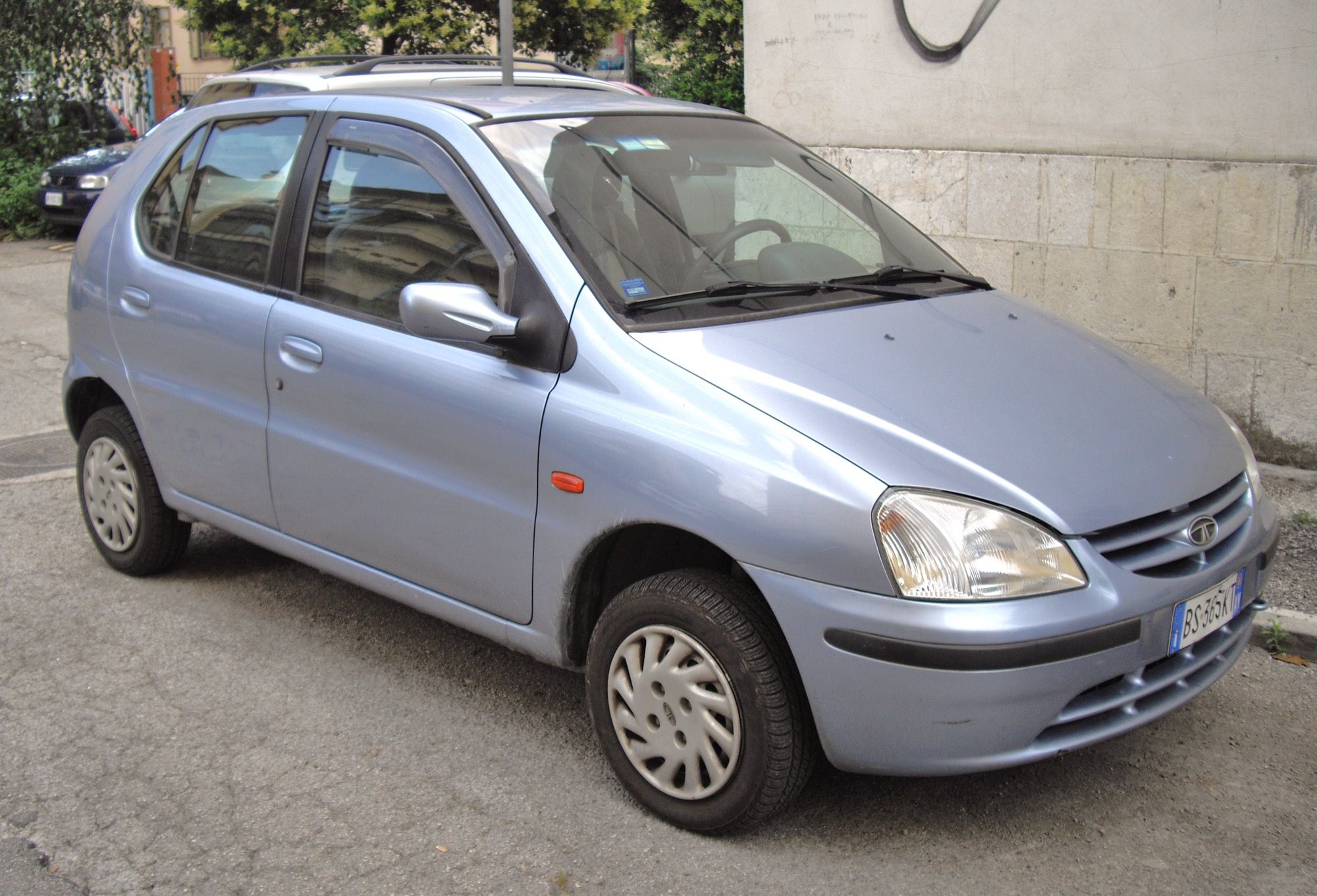 Light-blue first-generation Tata Indica hatchback, front three-quarter view