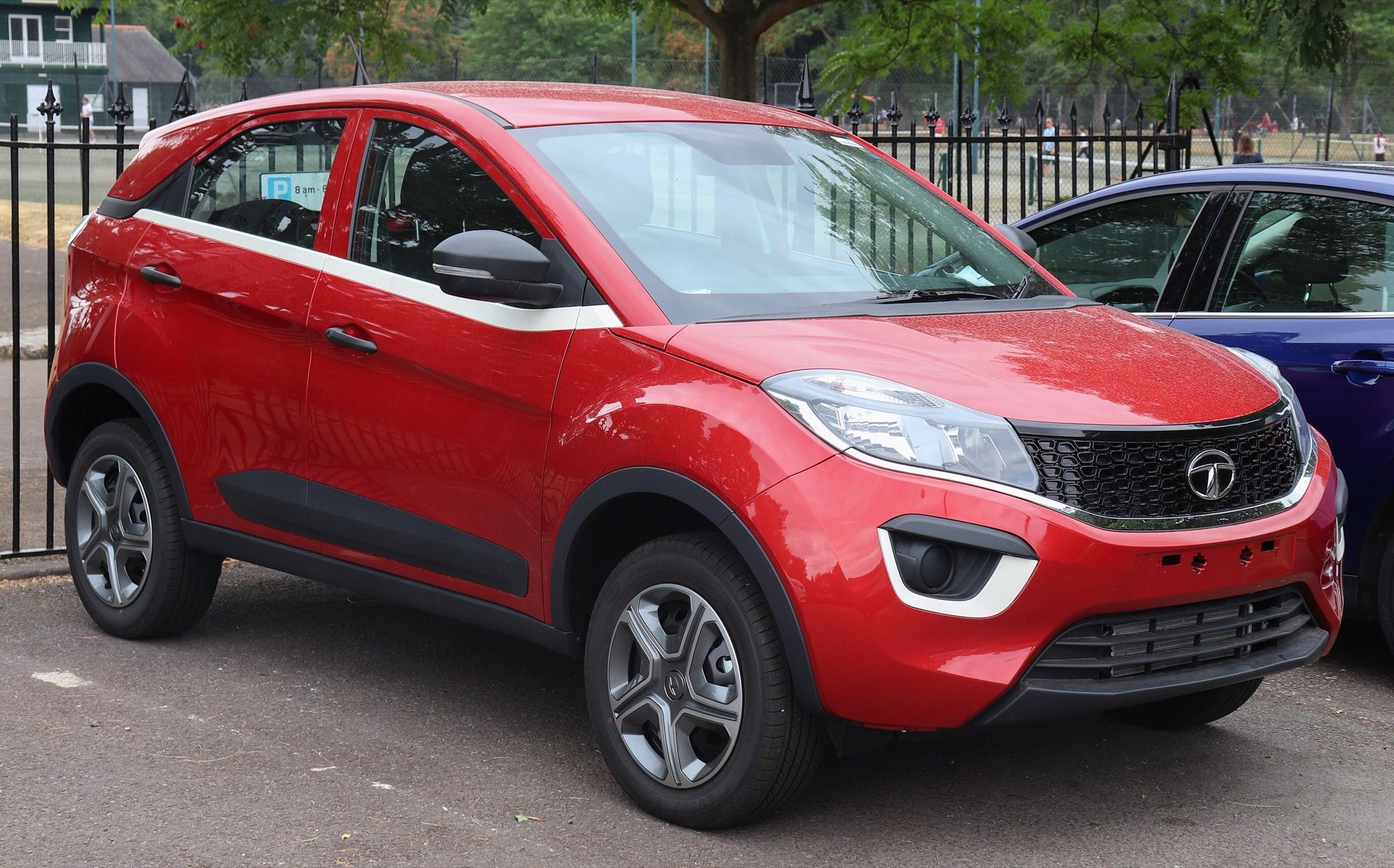 Red first-generation Tata Nexon compact SUV, front three-quarter view
