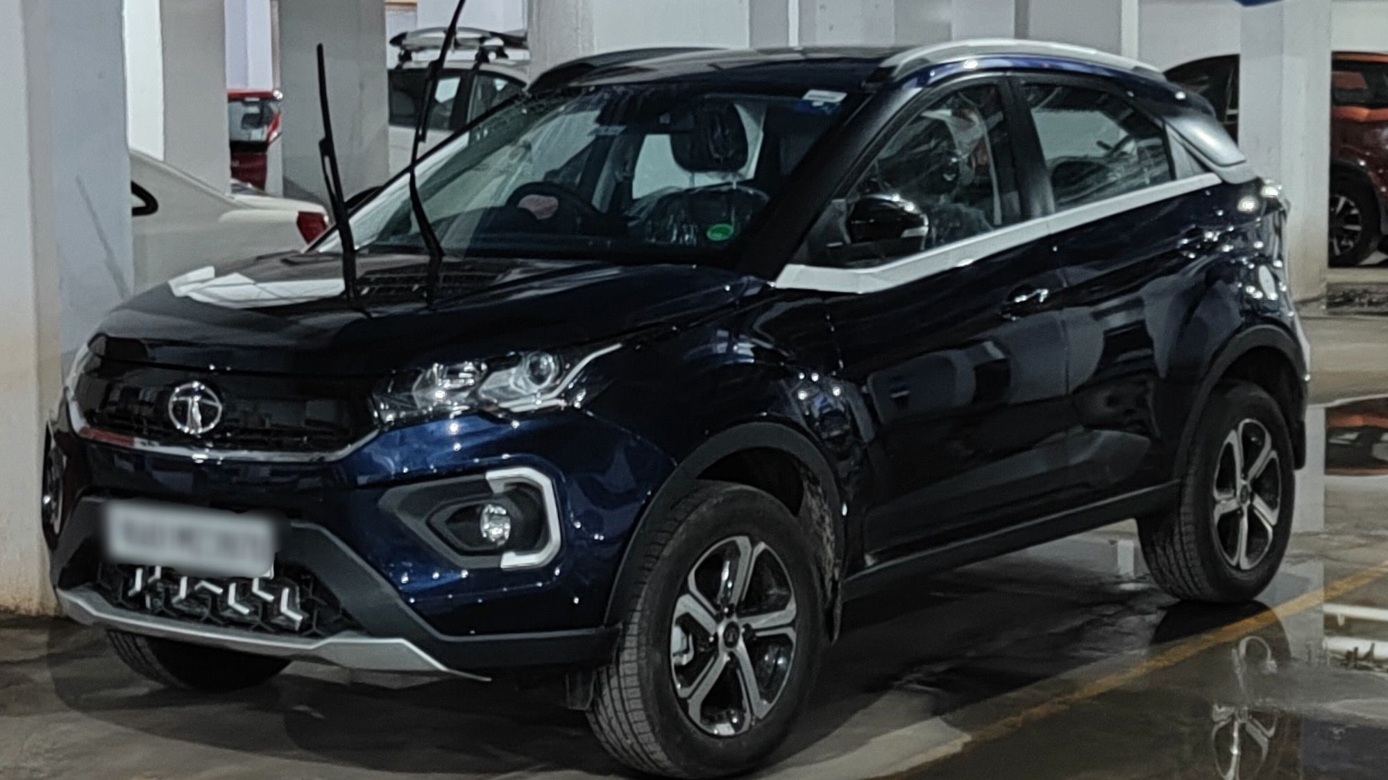 Dark-blue Tata Nexon Impact 2.0 facelift SUV, front three-quarter view