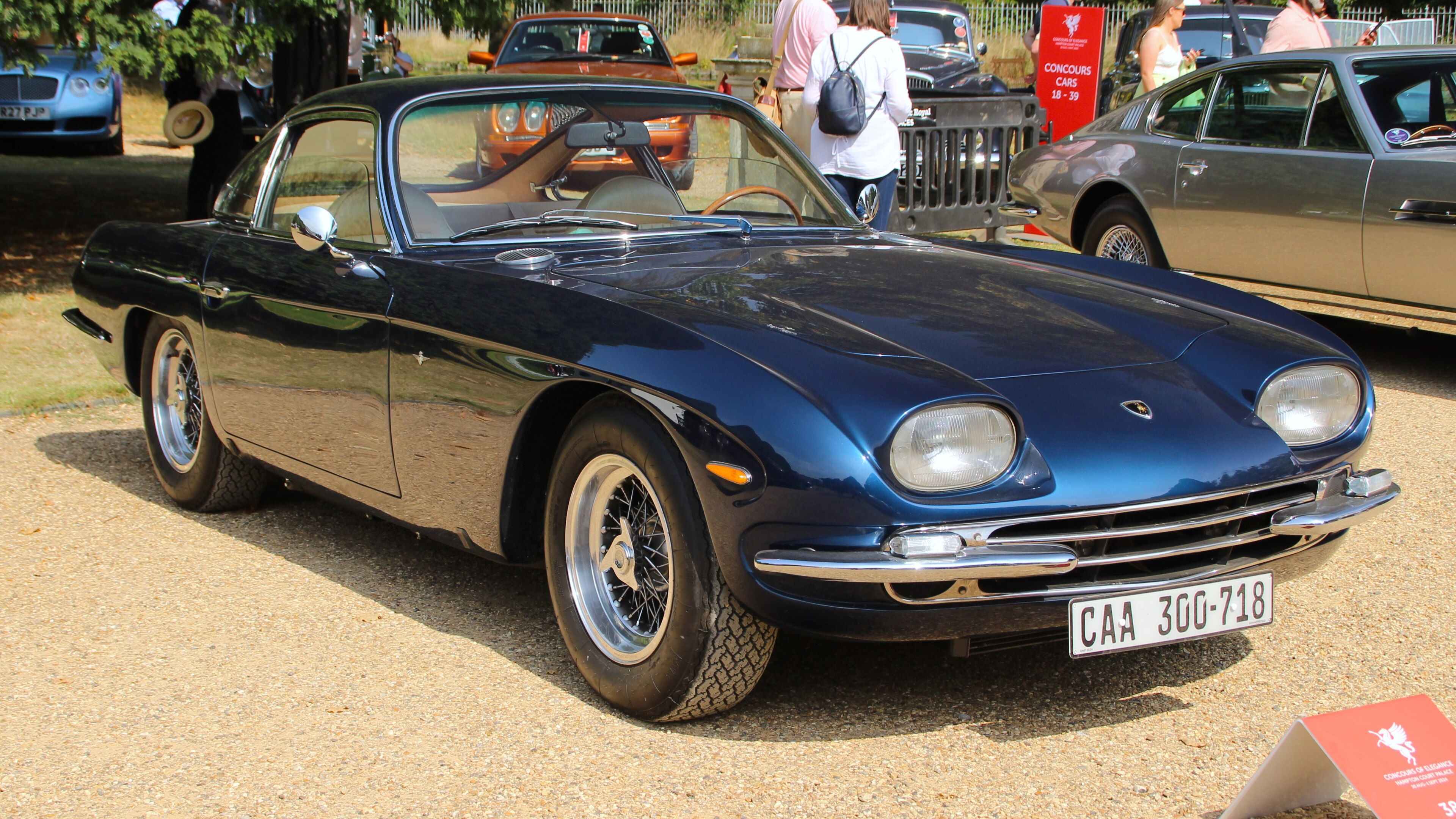 Dark blue 1965 Lamborghini 350 GT Touring coupe, front three-quarter view