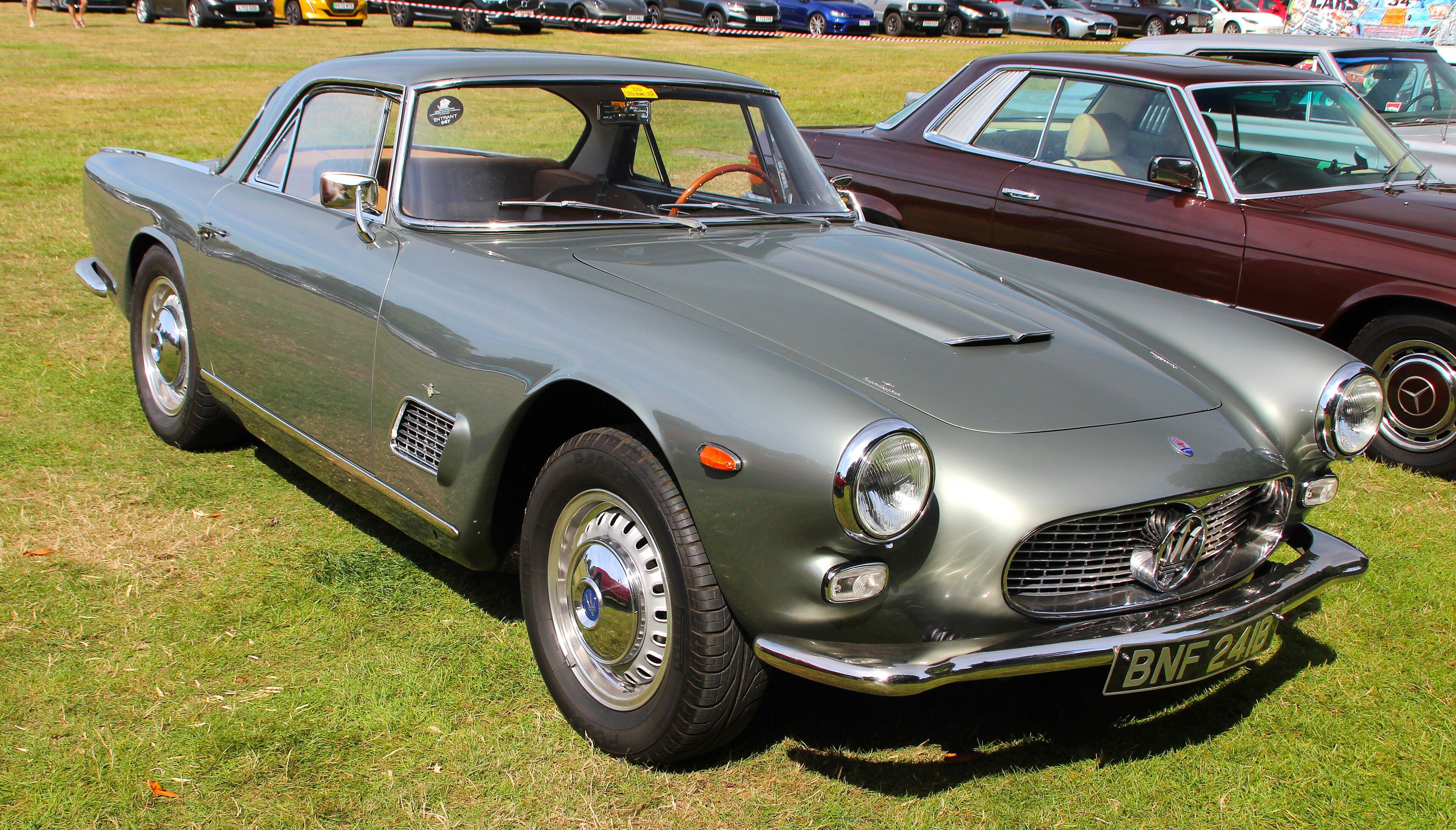 Silver-green 1962 Maserati 3500 GT Touring coupe, front three-quarter view