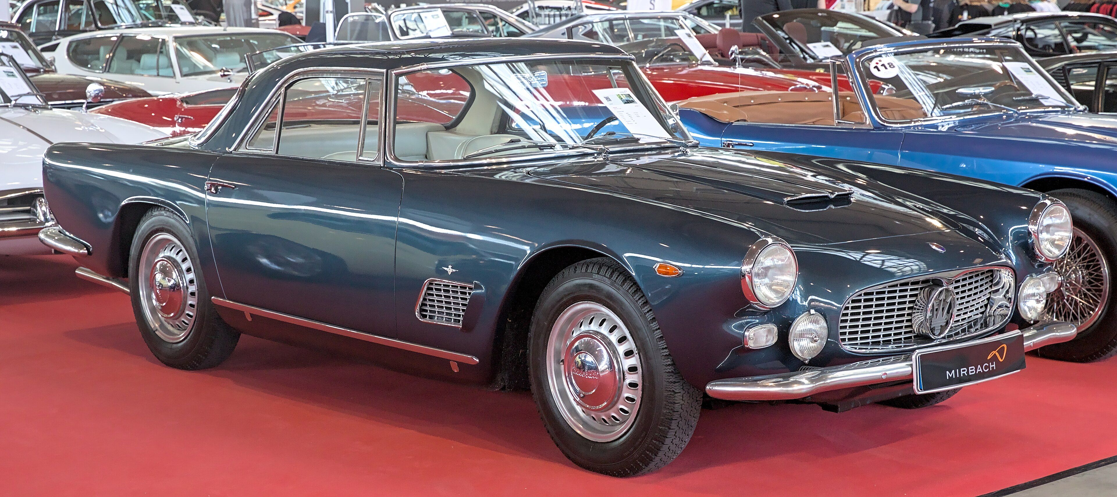 Blue 1964 Maserati 3500 GTI Touring coupe, front three-quarter view