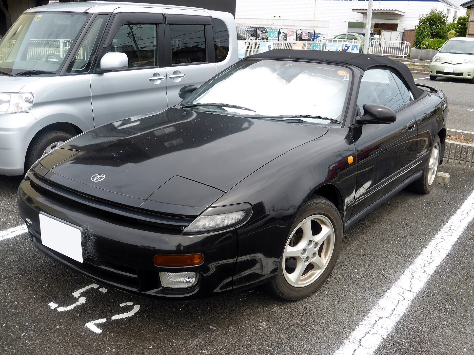 Black fifth-generation (T180) Toyota Celica convertible, front three-quarter view