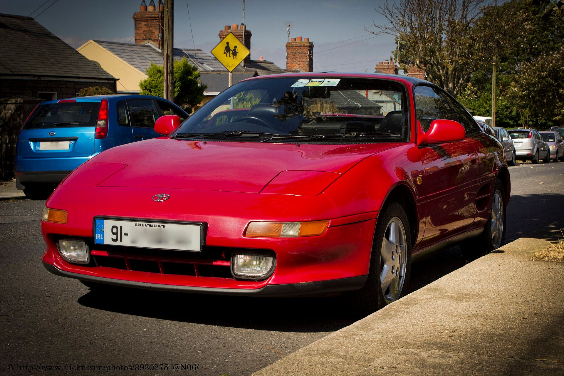 Red 1991 Toyota MR2 (SW20) coupe, front three-quarter view