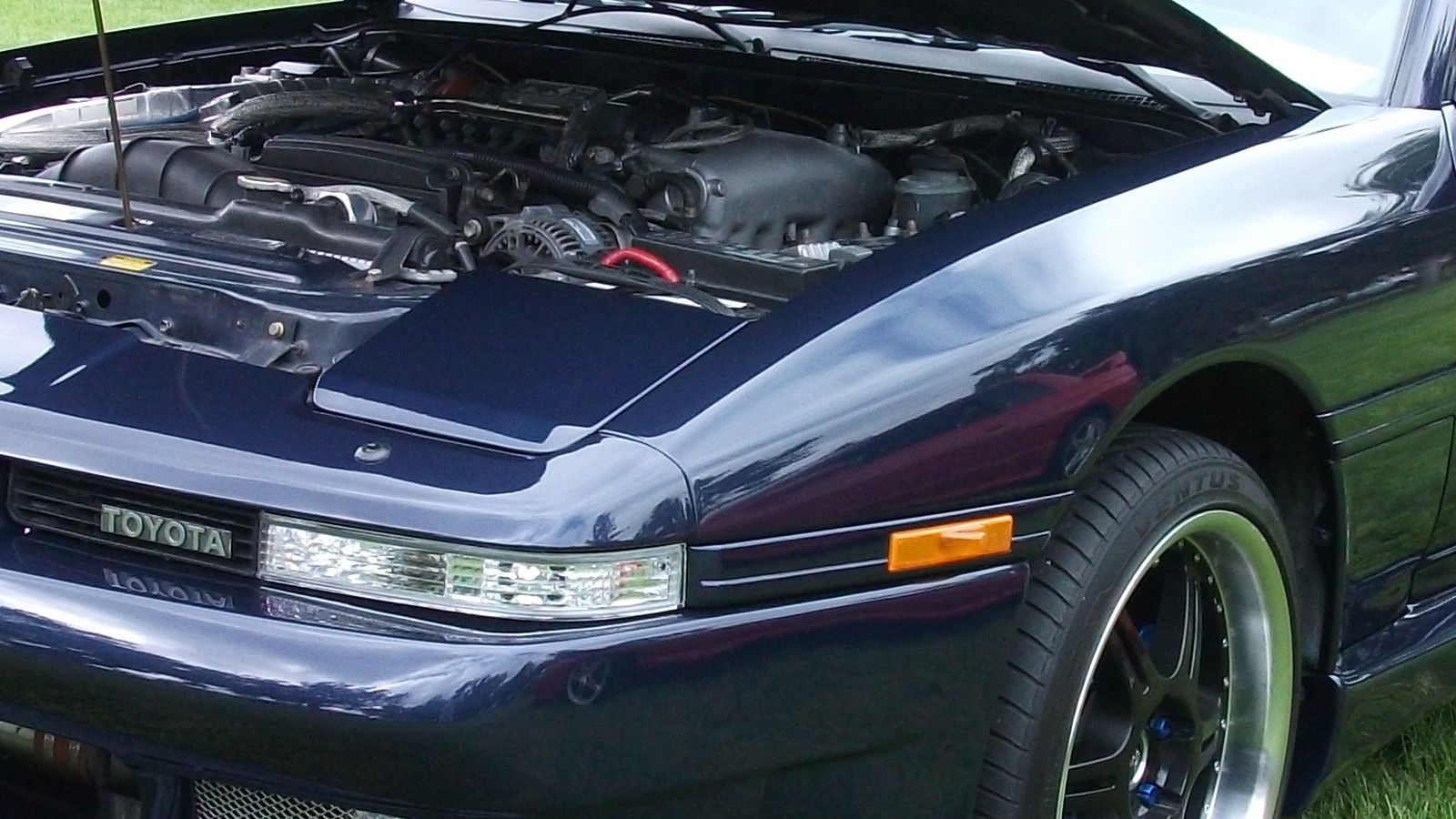 1990 Toyota Supra, third generation — red coupe, front three-quarter view