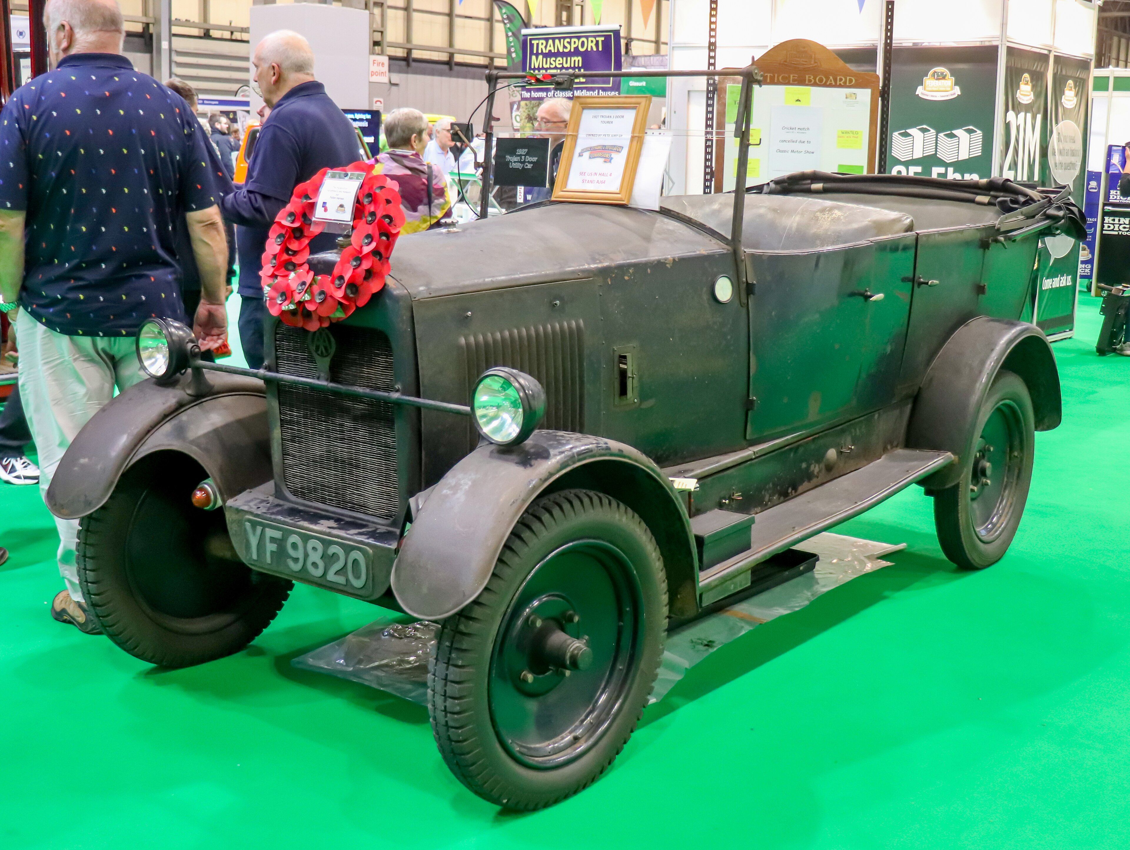 Green 1927 Trojan three-door tourer, front three-quarter view, at a classic motor show