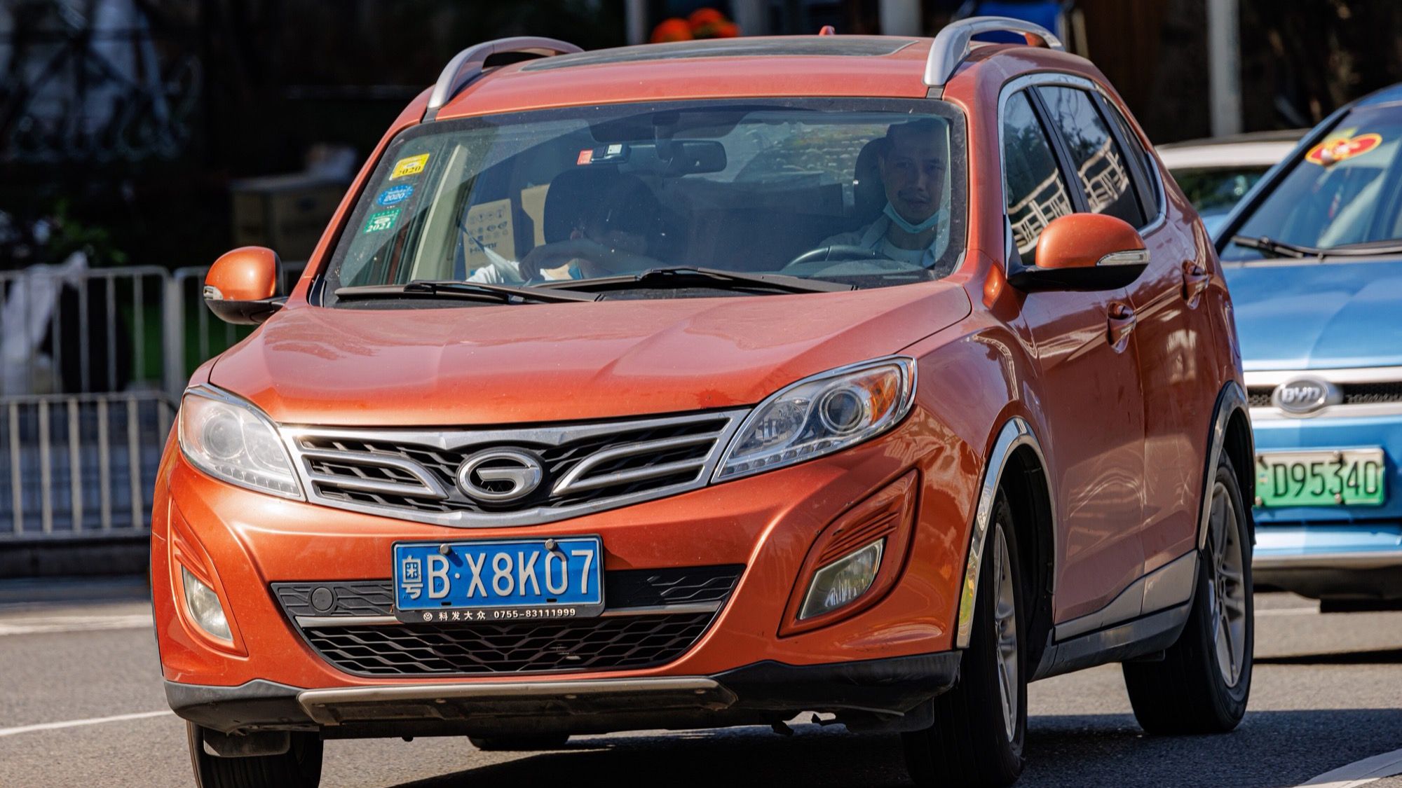 Orange first-generation Trumpchi GS5 SUV, front three-quarter view