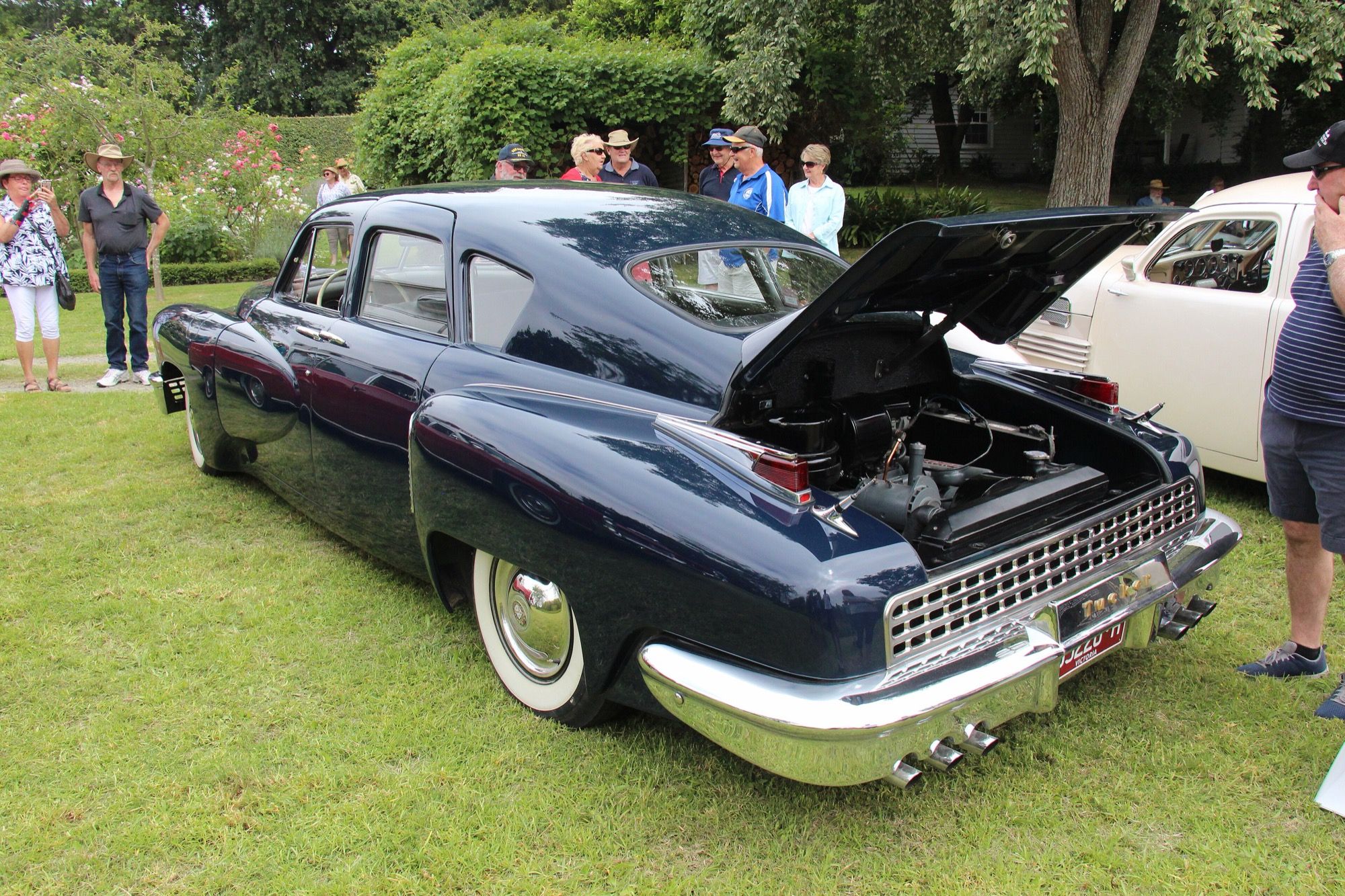 Dark 1948 Tucker 48 sedan on display, front three-quarter view