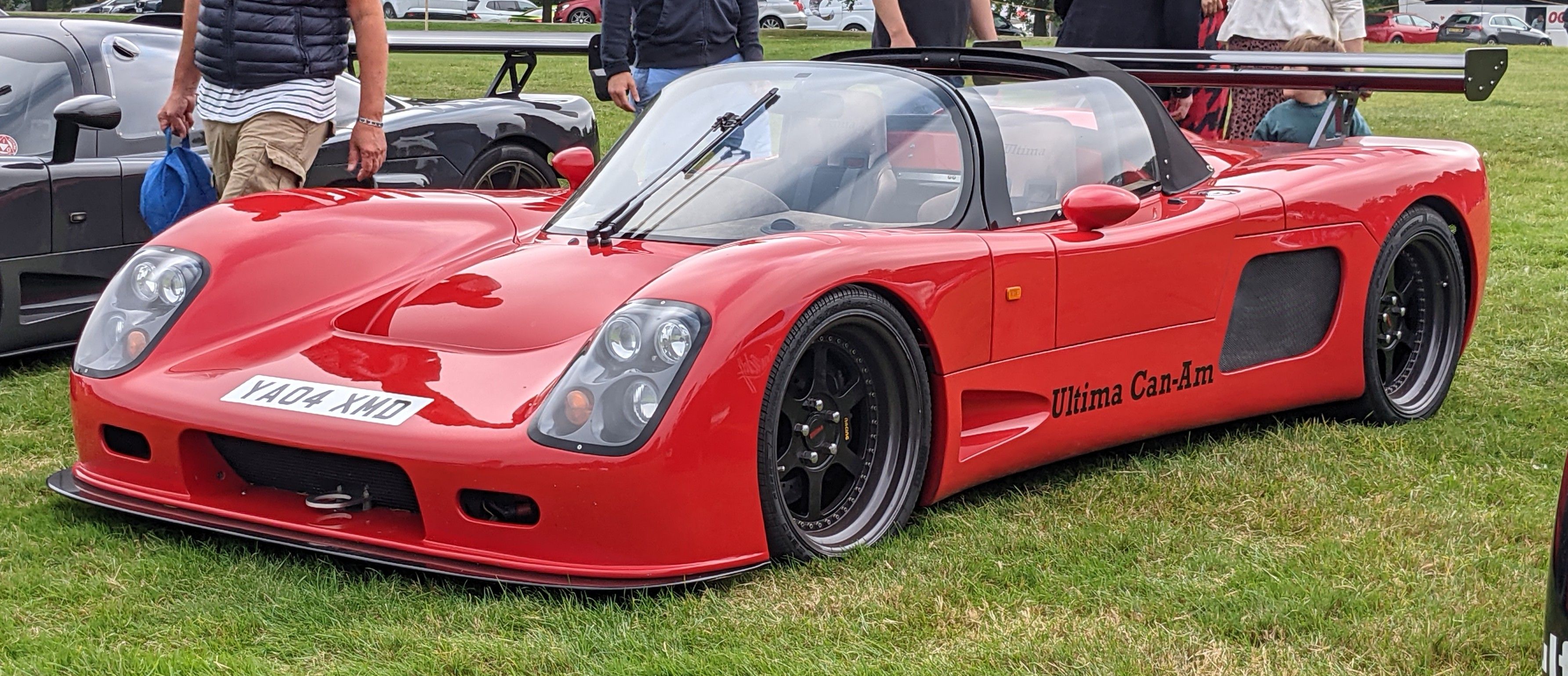 Red 2004 Ultima Can-Am 6.3 convertible, front three-quarter view