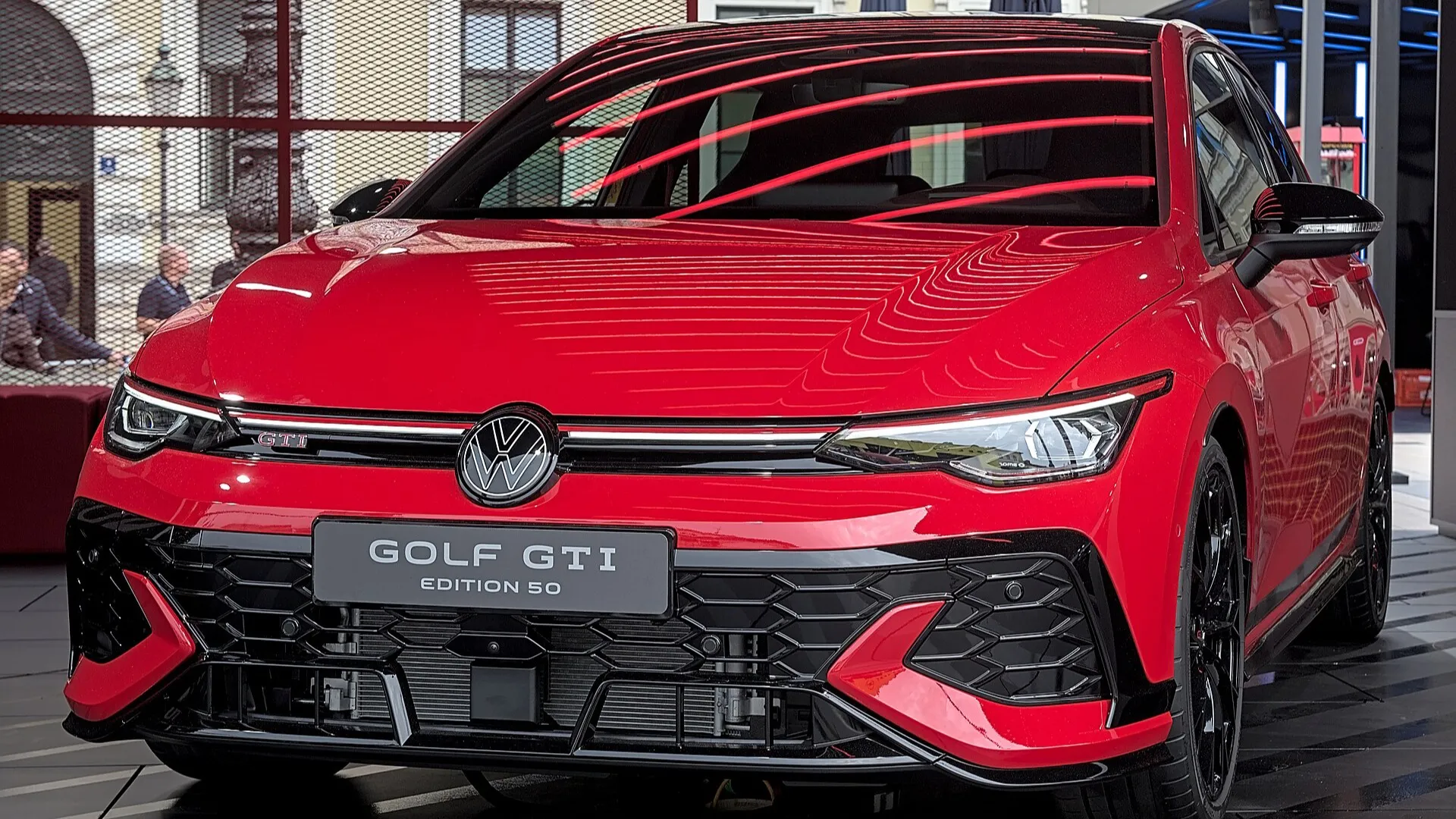 2026 Volkswagen Golf GTI Edition 50, red hatchback — front three-quarter view